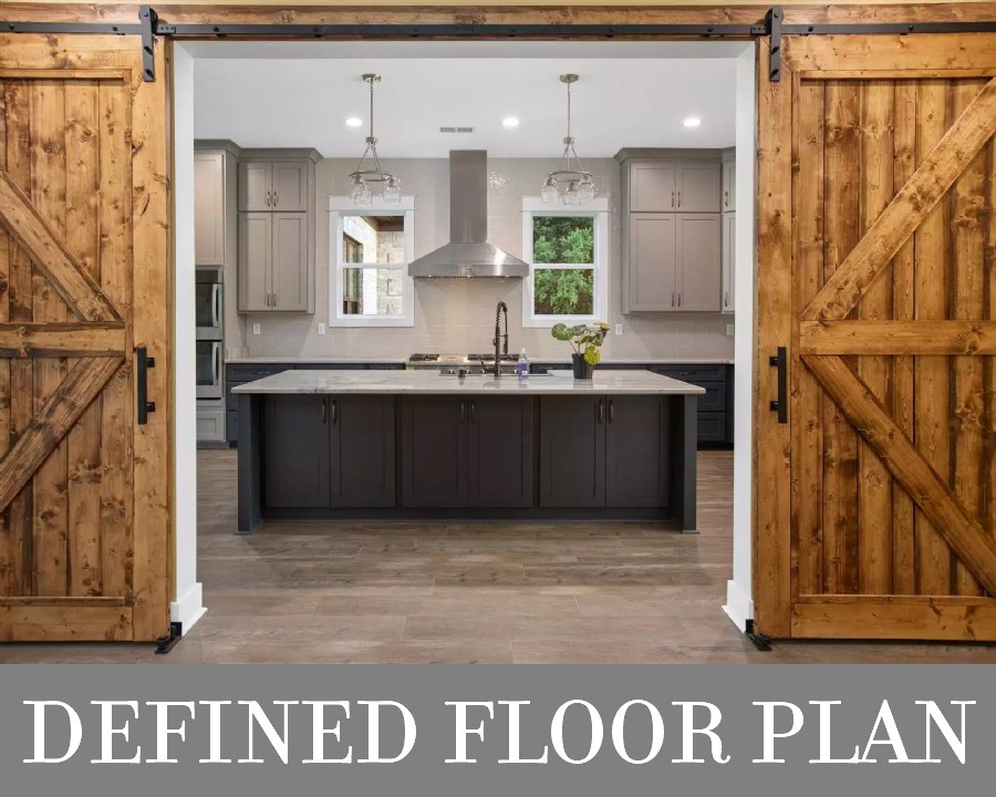 A Kitchen Behind Barn Doors in a Lovely Traditional Home with a Defined Floor Plan