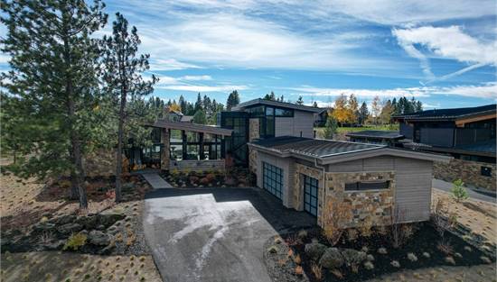 Contemporary Home with Large Windows & Stone Exterior